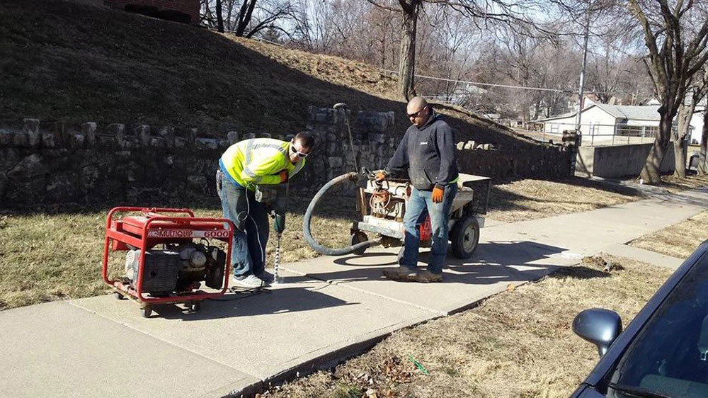 Workers Fixing Sidewalk